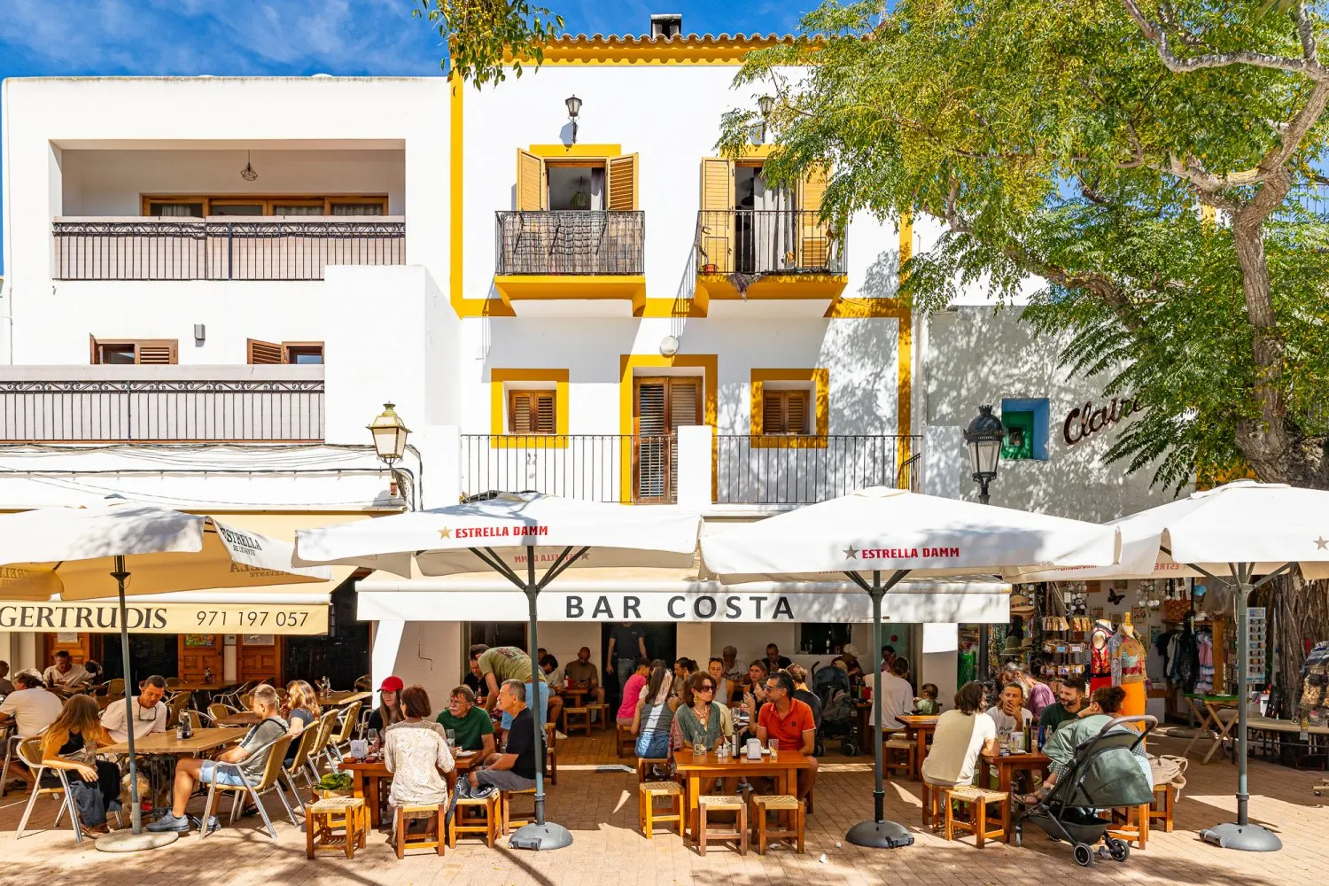 Santa Gertrudis Ibiza village with white buildings, cafes, outdoor seating, and local charm.